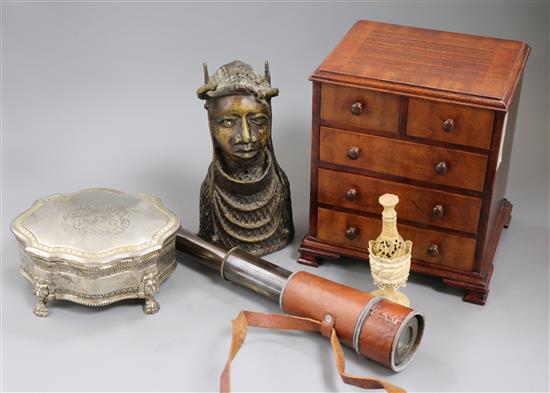 A miniature chest of drawers, a telescope, a Benin bust and plated box, and ivory seal and a shaker (bone)